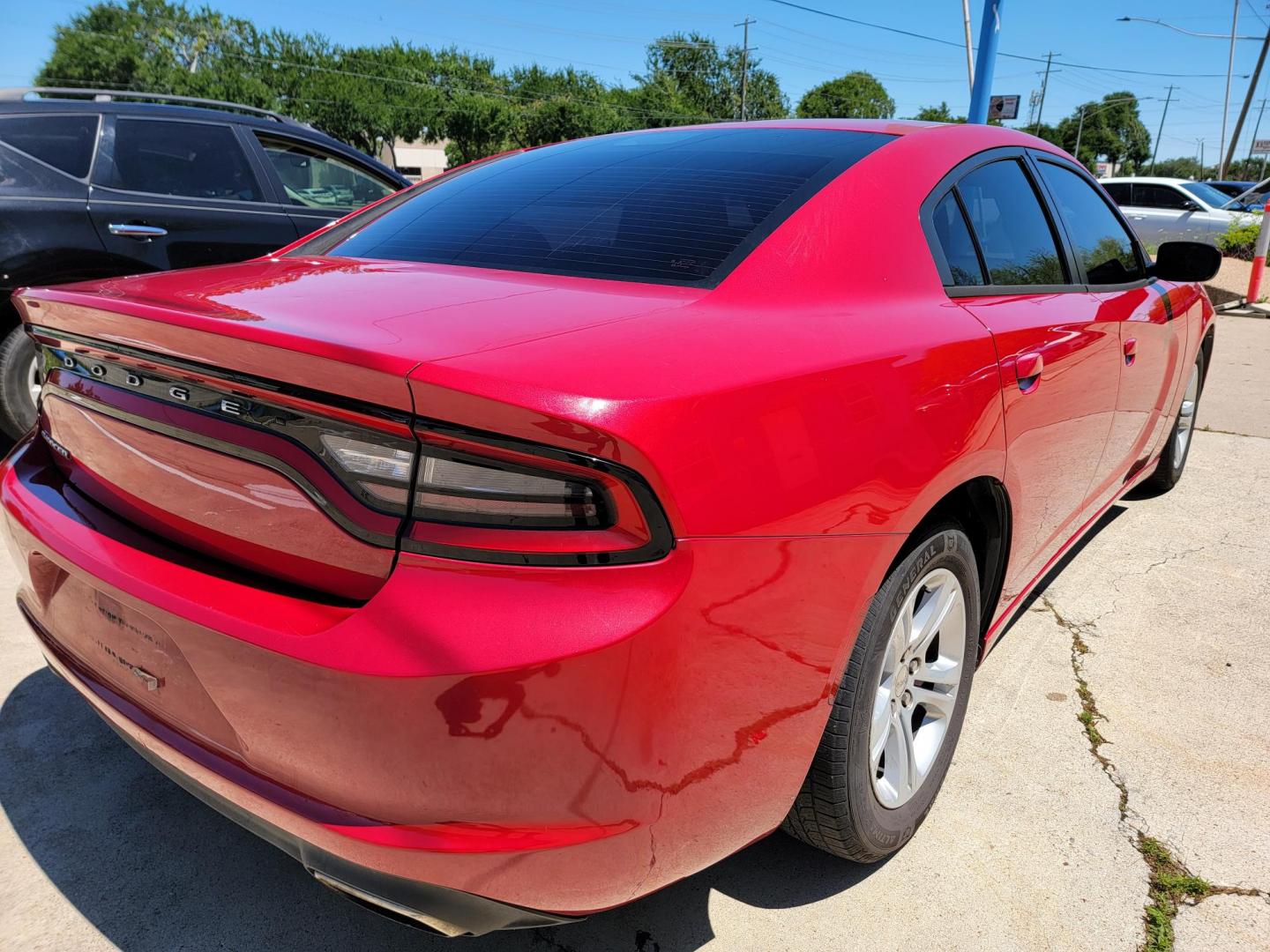 2016 Red /Black Dodge Charger SE (2C3CDXBG7GH) with an 3.6L V6 DOHC 24V engine, 8A transmission, located at 2020 East Division Street, Arlington, TX, 76011, (817) 801-3191, 32.742390, -97.076874 - Texass premiere Buy Here Pay Here with No Credit Check {score} at 2020 East Division Street Arlington, Texas in the center of Dallas, Fort Worth metro area. For in house auto financing in Lancaster, Waxahachie, Cleburne or Sherman call 817-801-3191. Denton, McKinney, Waco and Weatherford shoppers wa - Photo#2