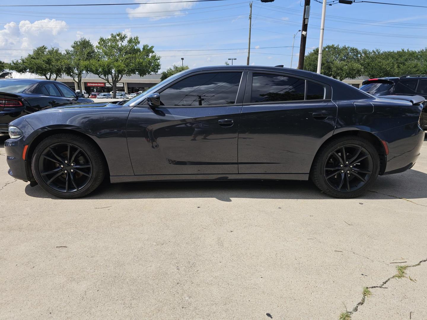 2016 GRAY /Dark Gray Dodge Charger SXT (2C3CDXHGXGH) with an 3.6 engine, Automatic transmission, located at 2020 East Division Street, Arlington, TX, 76011, (817) 801-3191, 32.742390, -97.076874 - This storm gray Dodge Charger is here for your next ride! Come check it out at DFW Carmart today! Premiere Buy Here Pay Here with NO Credit Check (score) at 2020 East Division Street, Arlington, Texas, located in the center of the Dallas/Fort Worth metro area. For in-house financing in Lancaster, - Photo#5